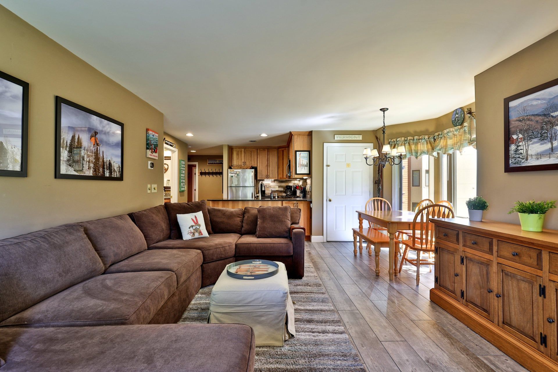 The open living area lets your group chat across the kitchen, dining table and sectional.