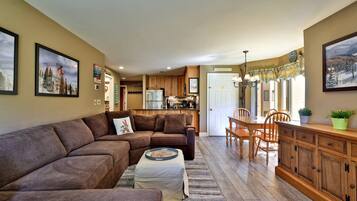 The open living area lets your group chat across the kitchen, dining table and sectional.