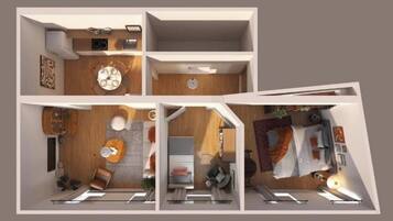 Ein modernes Interieur mit Essbereich, Küche und Wohnbereich.