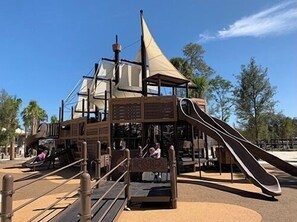 A playground with a slide and climbing structures. - Direct Oceanfront: Million Dollar Sunrise Views & Steps to Coligny (Hilton Head Island)