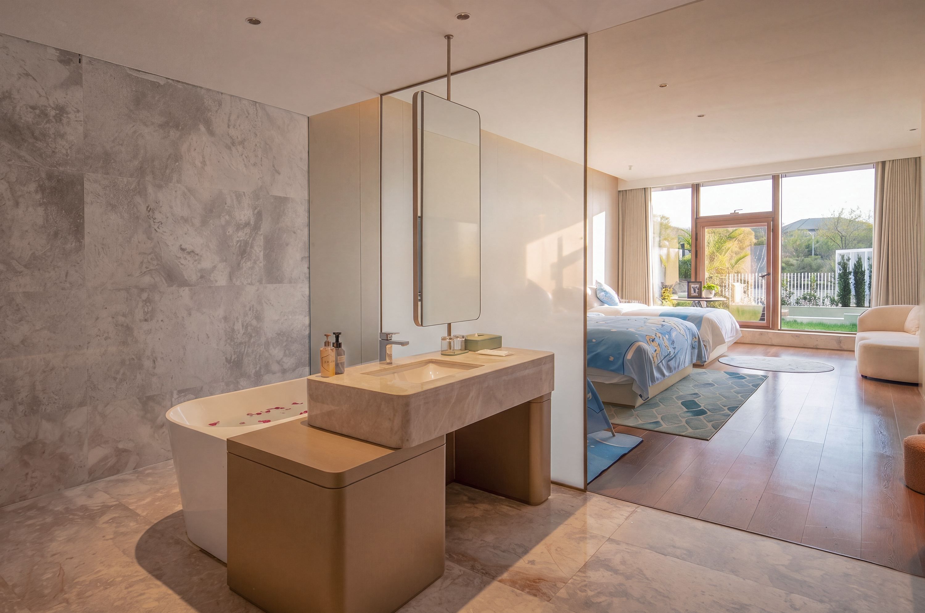 A modern bathroom with a large mirror, a bathtub, and a vanity with a sink.