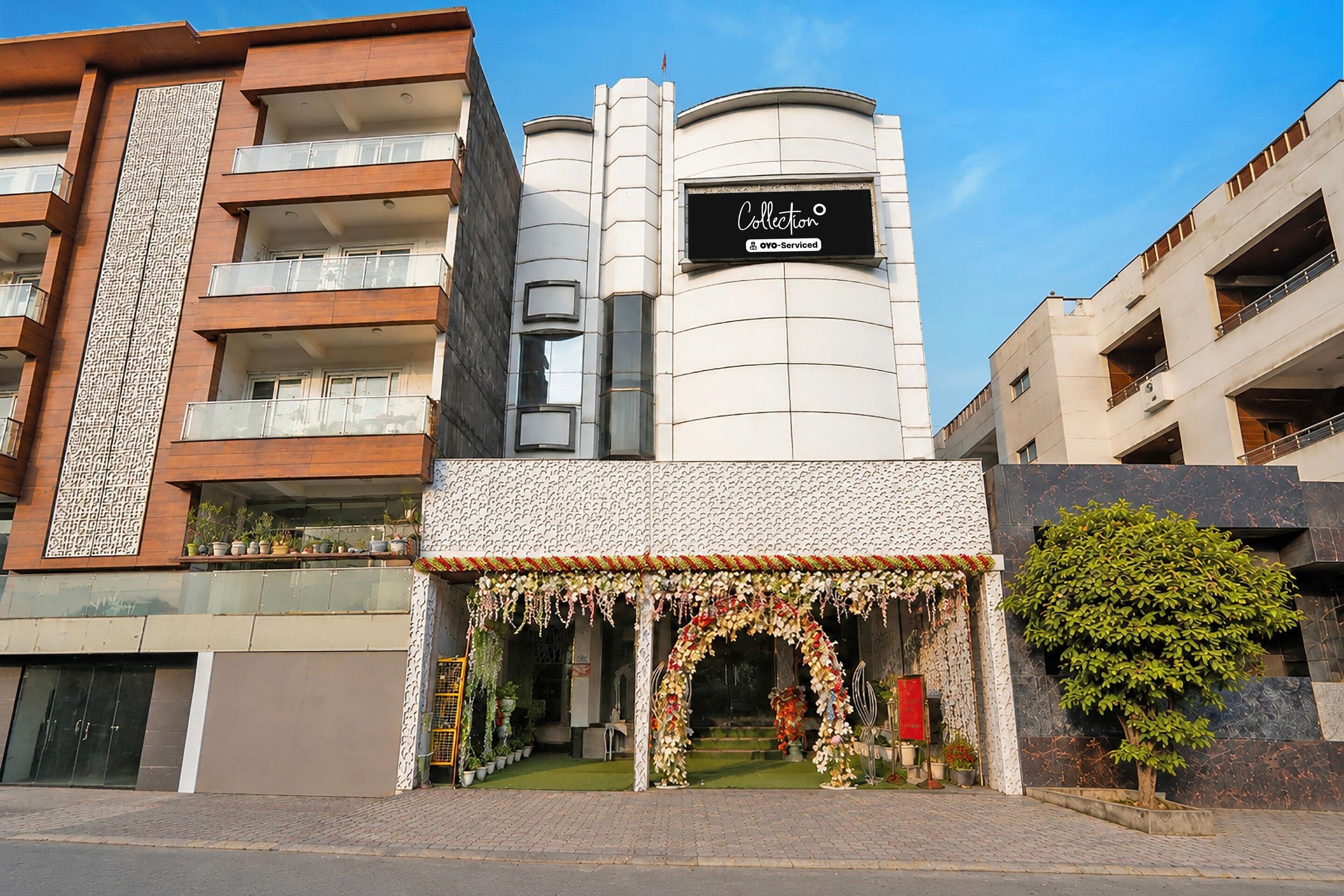 A building with a sign reading 'Collection' and 'OYO-Serviced'.