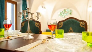 A dining table with a candelabra, glasses, and cutlery. - In the Heart of Florence · 4 Min to Duomo & David (FIRENZE)