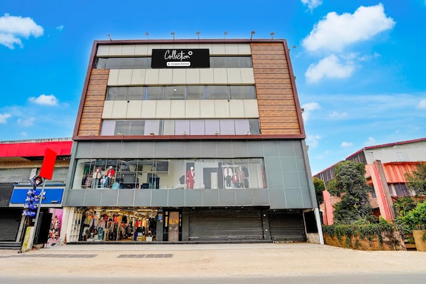 A multi-story building with a storefront on the ground floor.