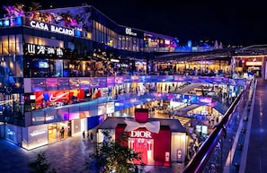 A multi-level shopping mall with various stores including a Dior outlet. - Siye Serviced Residence (Beijing)