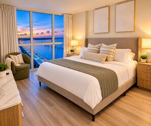 A hotel room with a large bed, a view of a bridge, and a cityscape. - The Solace • 22nd-Floor Retreat • Luxury River District • Pool + Skyline Views (Fort Myers)