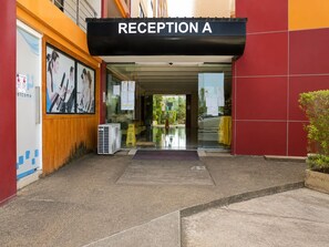 A reception area with a sign labeled 'RECEPTION A' above the entrance. - Studio apartment in tranquil Tambon Mai Khao with AC (Tambon Mai Khao)