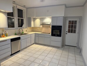 A kitchen with white cabinets, a dishwasher, a sink, and an oven. - 2 Bedrm Estate Phenix city. Minutes from uptown Columbus. More bedrooms soon! (Phenix City)
