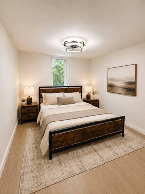 A bedroom with a large bed, two bedside tables, a nightstand, a window, and a wall-mounted artwork. - Spacious & Stylish Retreat in Northeast DC (Washington)