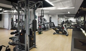 A gym with various exercise equipment, including treadmills, weight machines, and free weights. -  Deluxe 2-bedroom condo ski in-out on slopes of Park City! Pool and hot tubs! (Park City)