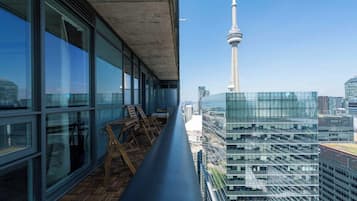 A high-rise building with a view of the CN Tower.