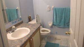 A bathroom with a sink, toilet, and a mirror. - Cosy Room with exclusive bathroom (Mississauga)