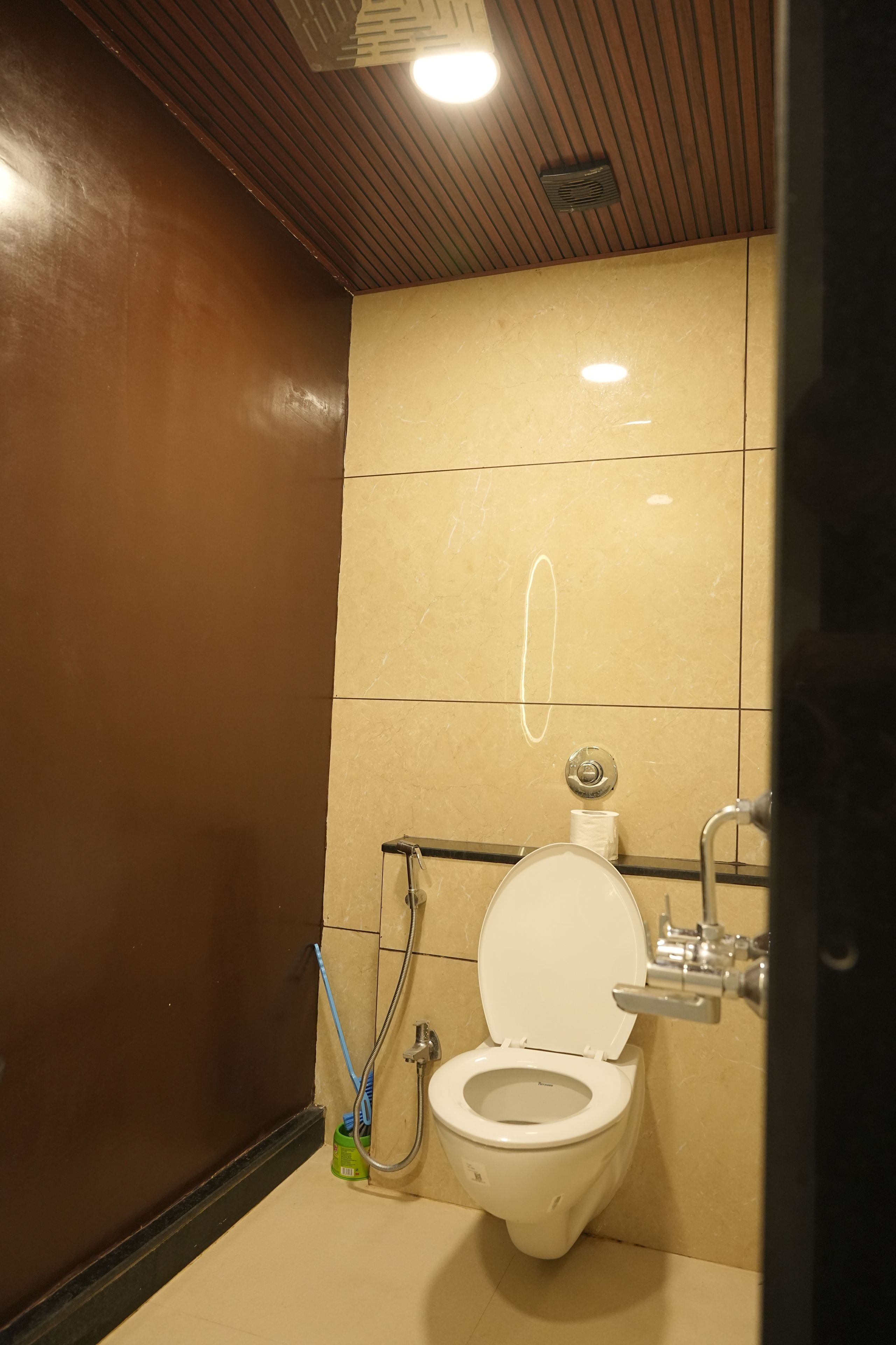 A bathroom with a toilet, sink, and shower.