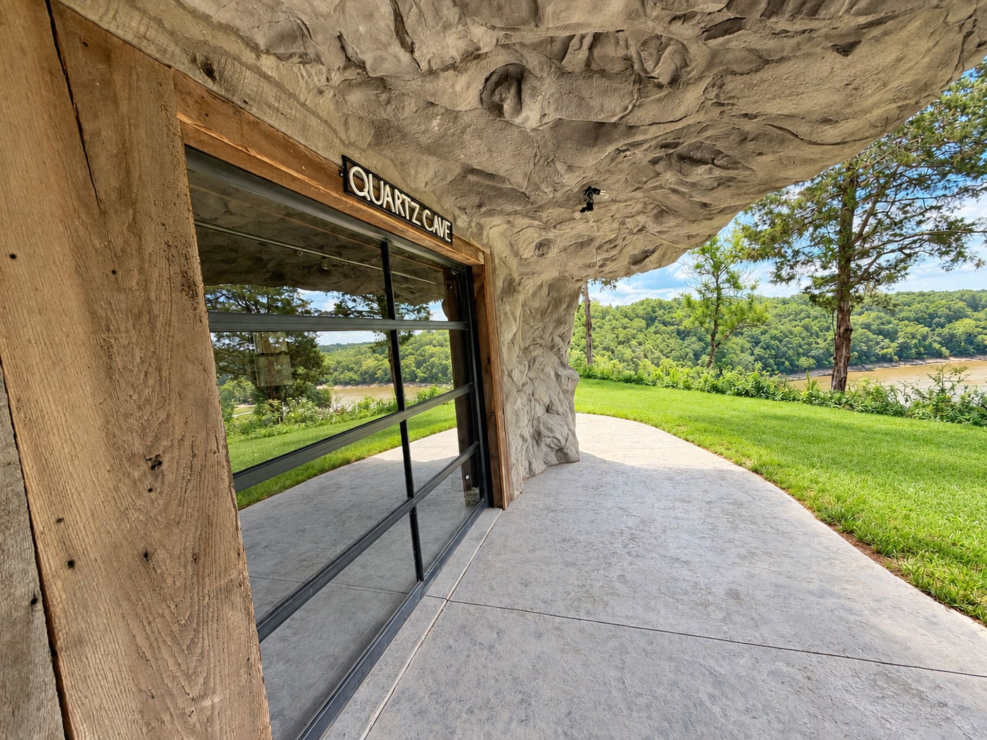 A building entrance with a natural rock facade and a sign that reads 'QUARTZ CAVE.'