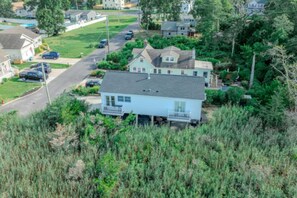A residential house with a front porch, a driveway, and a street view. - •Bay Views• Close to Cape May & Wildwoods • (Middle Township)