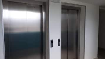 Two elevator doors in a modern building.