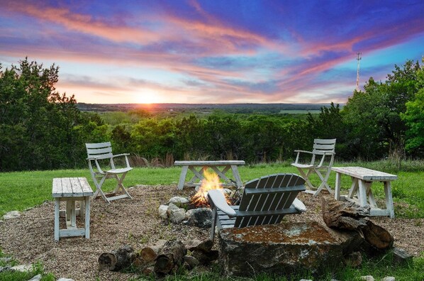 Hilltop fire pit with sunset views and cozy outdoor seating