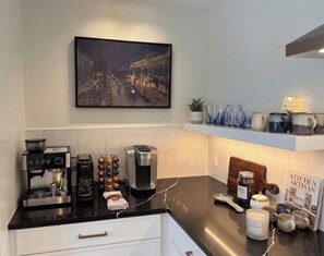 A modern kitchen with a coffee machine, a toaster, and a jar of jam on the counter. - Luxury built 4-bedroom house with spa like amenities in charming Narrowsburg (Narrowsburg)