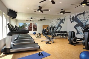 A gym with treadmills, weights, and exercise balls. - Walk to WM Phoenix Open & the Bird's Nest! Luxury 1BR Villa (Scottsdale)