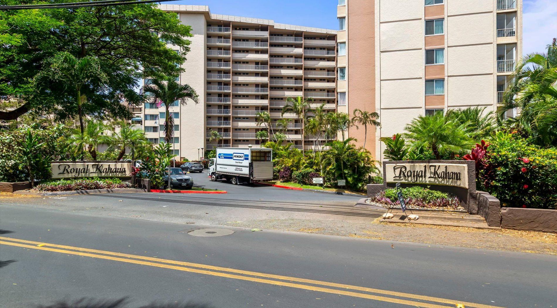 A gated entrance to a hotel with a sign reading 'Royal Kahuna.'