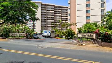 A gated entrance to a hotel with a sign reading 'Royal Kahuna.'