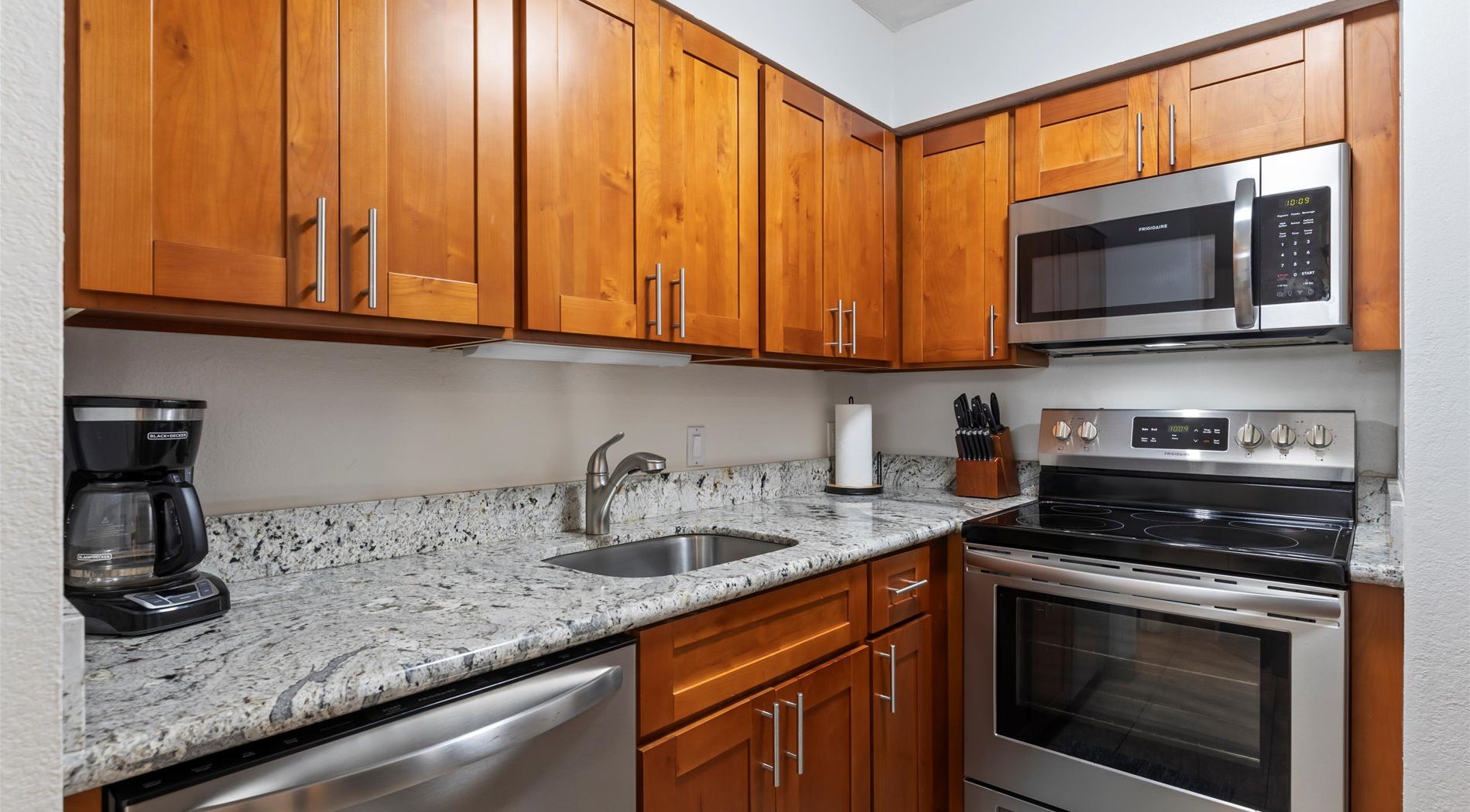 Open style kitchen stocked with all the basics for an island feast