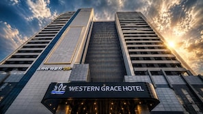 A hotel with a modern architectural design, featuring a prominent entrance with a sign that reads 'Western Grace Hotel.' - Incheon Grace Hotel (Incheon)