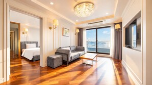 Suite familiare, balcone, vista oceano | Area soggiorno
