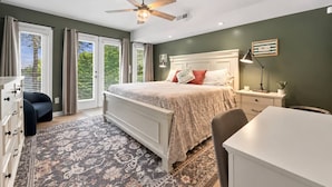 A bedroom with a bed, a desk, a chair, a dresser, and a ceiling fan. - Elevated VIEWS, Outdoorsy Vibe, Speakeasy Kg Suite (Leasburg)
