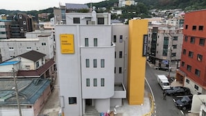 A multi-story hotel building with a sign indicating 'Andong Hotel Coolstay.'