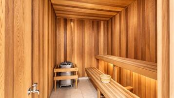 A sauna with wooden walls and benches.