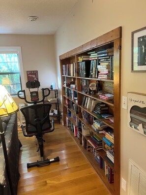 A home office with a desk, chair, and a large bookshelf filled with books. - Mountain Refuge “Lord, You have been our refuge in every generation.”Ps 90:1 (Franklin)