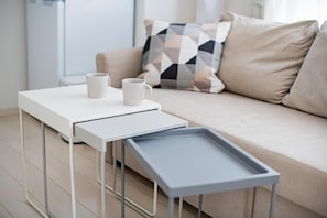 A modern living room with a white table, two white mugs, and a grey tray. - Presence Hakata (Fukuoka City Hakata-ku Chiyo)