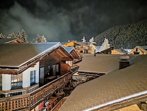 A wooden cabin with a balcony overlooking a snowy landscape. - Wohnung Auri by Interhome (Saas-Fee)