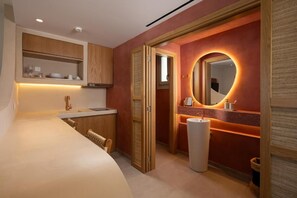 A modern bathroom with a vanity, mirror, and toilet. - Gea Perla Serifos (Serifos)