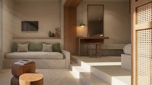 A modern interior with a sofa, a wooden table, a mirror, and a staircase. - Gea Perla Serifos (Serifos)