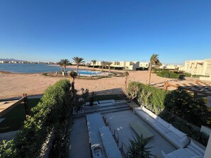 A resort with a pool, beach, and ocean view. - Bohemian-Style 3BR Townhouse in Shedwan, El Gouna. (Hurghada)