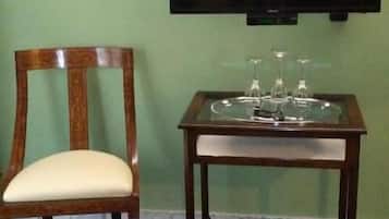 Junior Triple Room, Balcony, City View | Living area