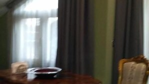 A room with a round wooden table, a chair, and a window with curtains. - Animosa Suite (Castiglione di Sicilia)