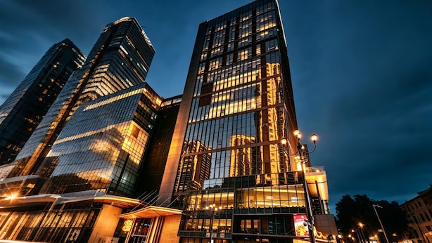 A modern high-rise building with reflective glass facades and a prominent entrance with a canopy. - Yu'an Hotel Guangzhou Zhujiang New Town (Guangzhou)