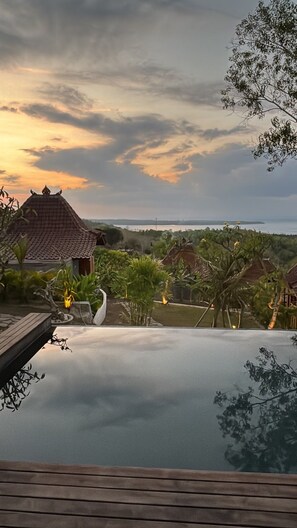 A serene pool area with traditional architecture and a view of the landscape. - La Colline Nusa Penida (Penida Island)