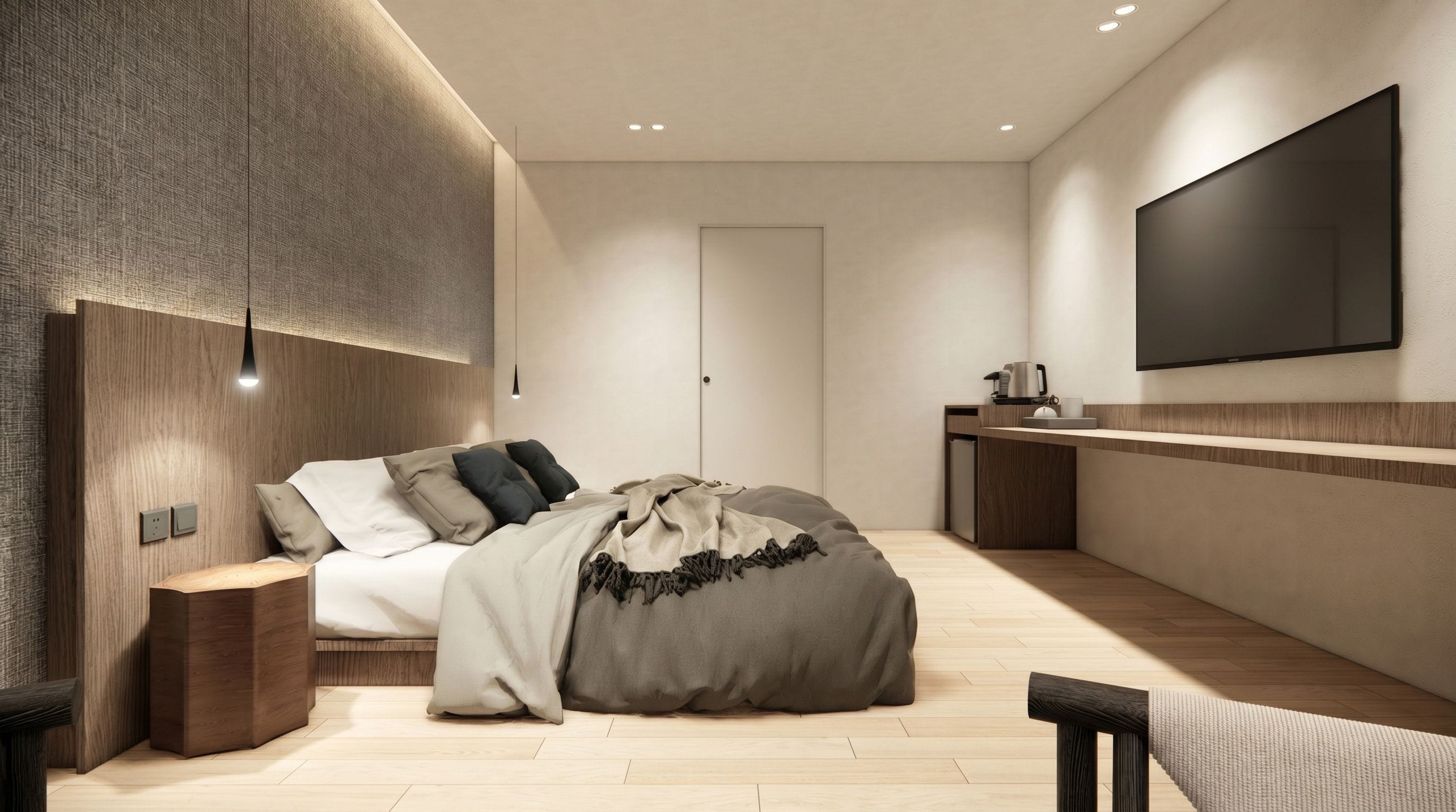 Une chambre à coucher moderne, avec un lit, une table de chevet et un grand téléviseur à écran plat fixé au mur.