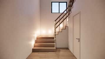 A staircase with wooden steps and a metal railing leading to a door.