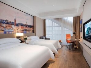 A hotel room with two beds, a television, a desk, and a chair. - Vienna International Hotel (Nanping)