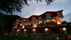 A multi-story hotel with balconies and a stone facade. - Koru Otel & Restaurant (Artvin)