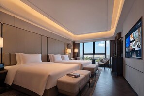 A modern hotel room with two beds, a TV, and a view of the city. - Wyndham Changsha Yanghu (Changsha)