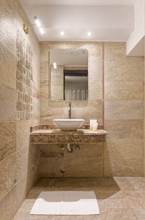 A bathroom with a freestanding sink, a mirror, and a shower area. - Vesta - Luxury APT - 2BR - South Academy II (Cairo)