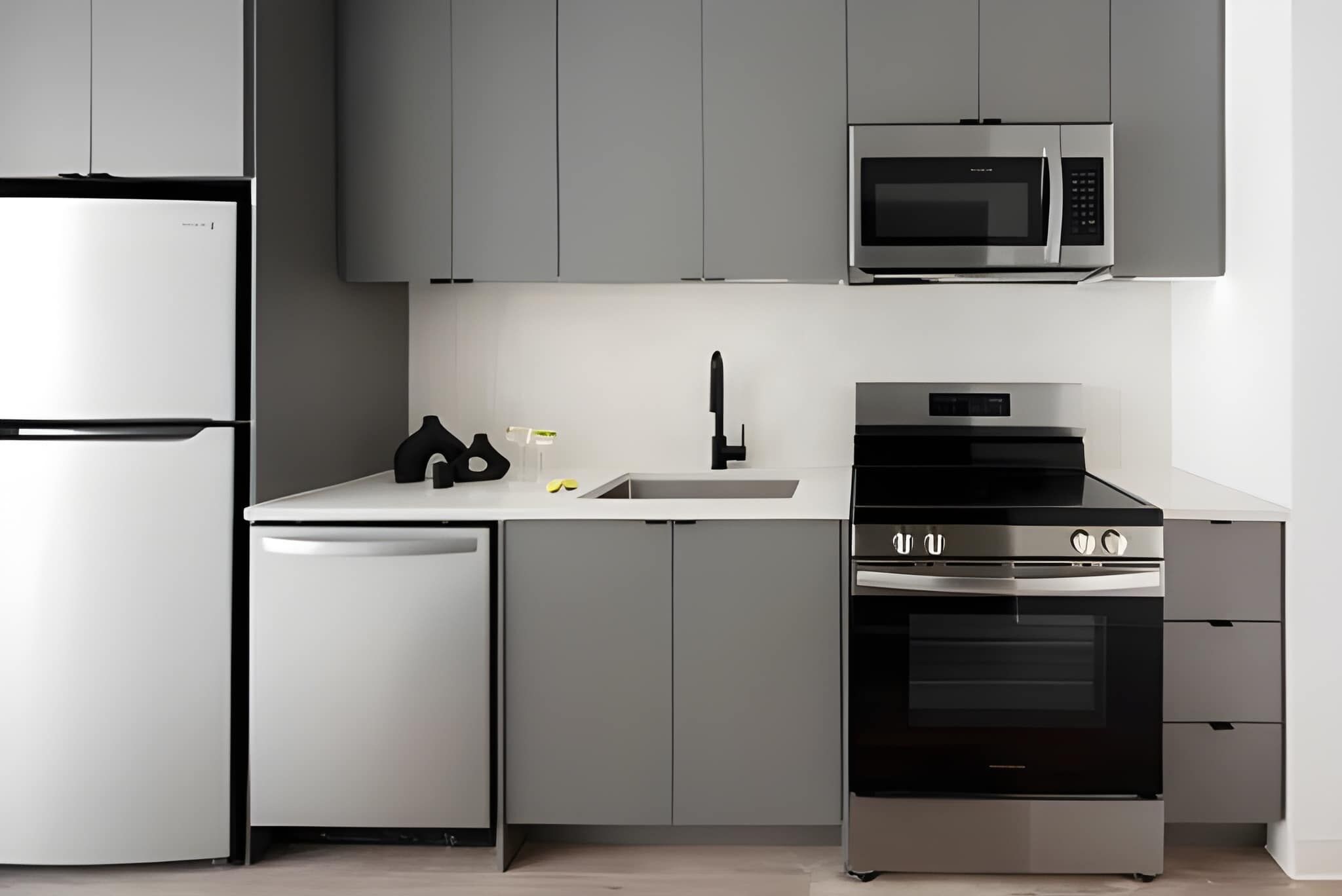 A modern kitchen with a built-in microwave, oven, and dishwasher.