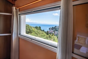 A window with a view of a coastal town and the sea. - Villa Frajeska with Private Pool by Konnect (Longos)