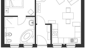 Een plattegrond met een terras, een badkamer, een keuken en een eetgedeelte.